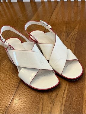 Woman’s Jil Sander white patent leather cross strap heeled sandal. Size 39. Cute